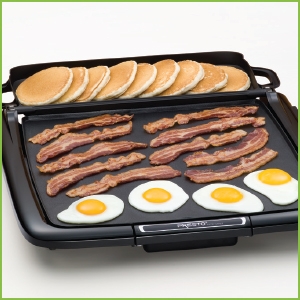 Exclusive Multi-Function Tray. Flips back to keep cooked foods like pancakes warm.