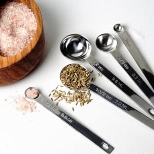 Measuring scoops, scooping salt 