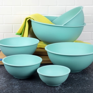 a family of light blue kitchen bowls on a countertop