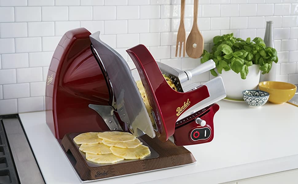 electric slicer on kitchen counter with sliced pineapple